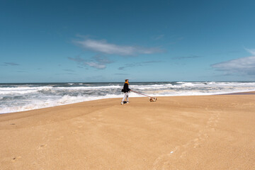 walking on the beach with dog