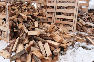 Wooden box with firewood. Chopped and hand-folded in a crate for sale or for storage in a cottage. transport by pallet truck.