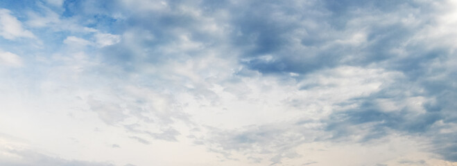 White sky with blue clouds in sunny weather
