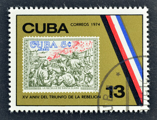 Cancelled postage stamp printed by Cuba, that shows Old Cuban stamp XV aniversario del triufo de la...