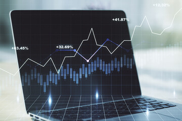 Double exposure of abstract creative financial diagram on modern laptop background, banking and accounting concept