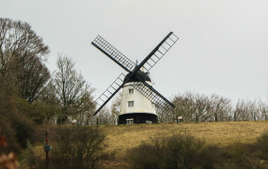 Naklejka na ściany i meble Windmill in the English countryside