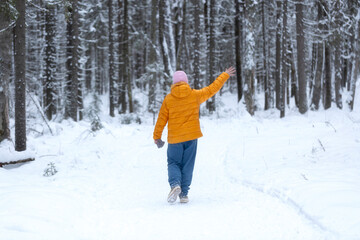 Fototapeta na wymiar Nordic walking in winter in the forest.A walk in the winter forest.