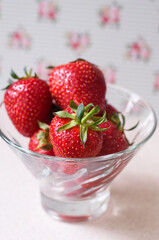 Strawberries contained in a glass bowl