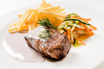 steak with french fries on white