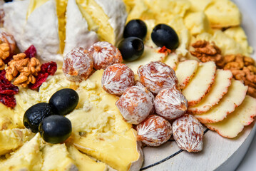 Set of mix of delicious cheeses in pieces, close-up