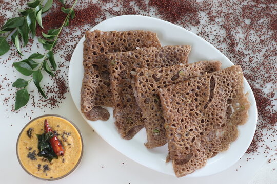 Instant Finger Millet Dosa, made with finger millet flour, curd and spices. Served with coconut chilly condiment