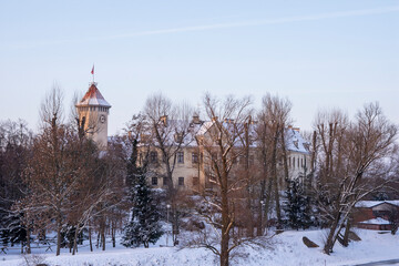 Frozen harbor and river covered with ice and floes in winter sunny sunset. Winter.
