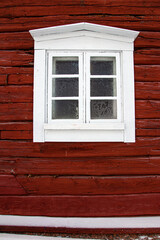Fototapeta premium White window on a red wall