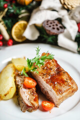 ribs with potatoes on white plate