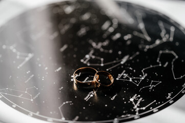 Gold rings of newlyweds, wedding accessories, rings close-up.