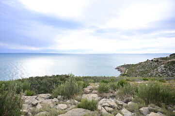 Morning view of the Mediterranean Sea with blue sky and blurry clouds background 