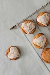 Sweet heart on the oatmeal cookies, cookies for valentine's day, homemade brown cookies on the white background, cookies on a baking rack, glazed cookies, round homemade cookies