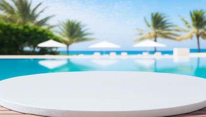 Empty ceramic mosaic table top and blurred swimming pool in tropical resort in summer banner background, for display or montage your products