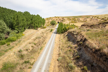 Fototapeta na wymiar Camino Natural Via Verde del Valle del Eresma - gravel road next to Los Huertos, province of Segovia, Castile and León, Spain
