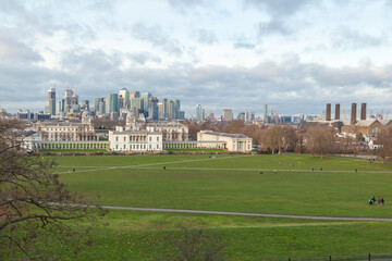 Fototapeta na wymiar Greenwich park, Royal Navy college and Queen palace, and Canary Wharf business international finance aria on the background 