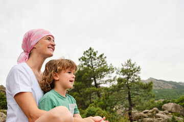 Woman with cancer enjoying nature with her son