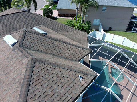 Residential Home with Pool Screen Enclosure form aerial drone