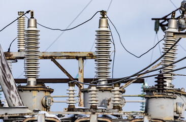 High voltage vintage electrical substation in Ukraine in winter. Wiring, connections and insulators. Russian missile attacks on Ukrainian energy during war. Shutdown. Power plant.
