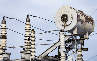 High voltage vintage electrical substation in Ukraine in winter. Wiring, connections and insulators. Russian missile attacks on Ukrainian energy during war. Shutdown. Power plant.