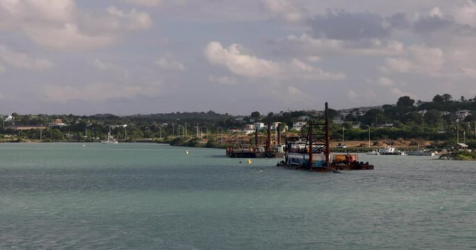 Antigua St Johns Caribbean departing marina industrial. Discovered by Christopher Columbus is 1493. Tourism is now main source of income. International airport and cruise ship, private luxury yachts.
