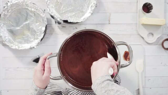 Flat lay. Step by step. Mixing ingredients in the cooking pot to make simple chocolate fudge.