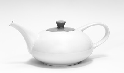 White teapot close-up on a white background isolated.