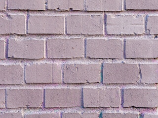 Painted brick wall. The texture of the brickwork. Vintage background with masonry.
