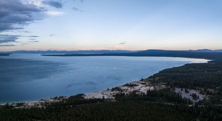 Beautiful evening view of the Yellowstone National Park over massive lake at sunset.