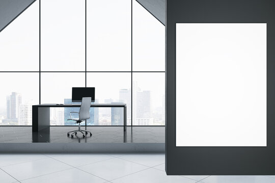 Front view on blank white poster on black wall in spacious office with modern computer on dark work table on glossy podium and city view background from big arch window. 3D rendering, mock up