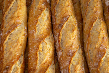 Stack of crispy baguettes at the bakery