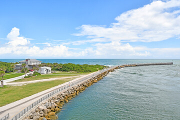 Fototapeta na wymiar Walkway leading to fishing pier at Sebastian Inlet in Brevard County on Florida's Space Coast