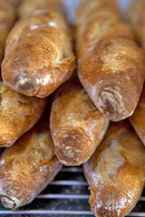 Stack of crispy baguettes at the bakery