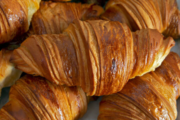 Closeup of freshly baked croissant on bakery
