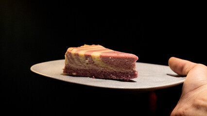 delicious cake slice: Cake slice in plate with black background.