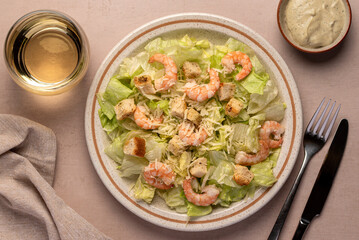 Food photography of caesar salad, prawn, iceberg, lettuce, parmesan, croutons, sauce
