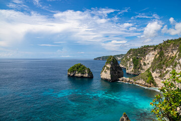 The beautiful sandy beach (Diamond beach) with rocky mountains and clear water in Nusa Penida, Bali, Indonesia