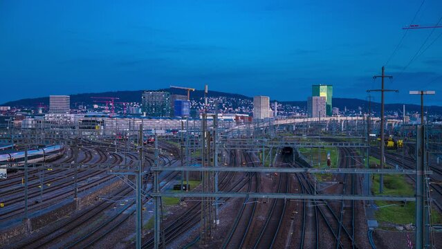 Day to night Zurich main railway station. Serving up to 2,915 trains per day, Z&uuml;rich main station is one of the busiest railway stations in the world.