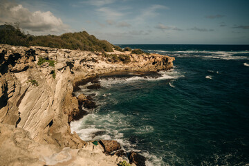 A view of the Pacific Ocean from the cliffs of the Mahaulepu Heritage Trail in Poipu, Kauai, Hawaii, USA