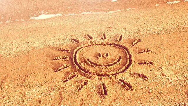 Sun drawing on the beach.	. Beach and drawing.