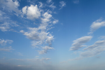 Summer evening sky in the picturesque clouds, lit by the rays of the setting sun.