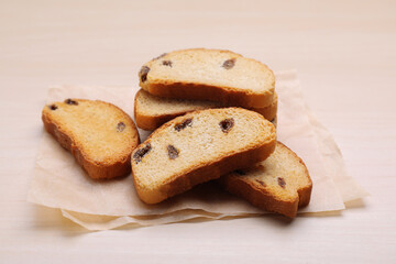Sweet hard chuck crackers with raisins on wooden table