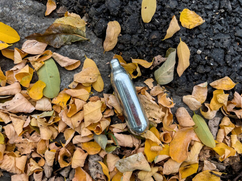 Used discarded nitrous oxide canisters found on the ground in the city - known as NOS or laughing gas - used by young people as a drug