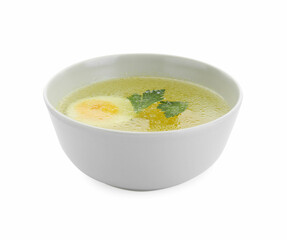 Delicious chicken bouillon with egg and parsley in bowl on white background