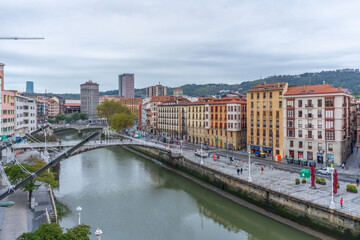 Fototapeta na wymiar Riverside area next to the Nervion river in the city of Bilbao in Vizcaya. Basque Country