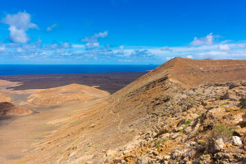 Fototapeta na wymiar Dramatic landscape viewed from the top of Caldera Blanca volcano, Lanzarote, Canary Islands, Spain