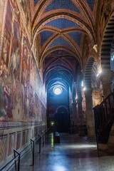San Gimignano, Italy, 15 April  2022: Beautiful frescoes in the medieval cathedral