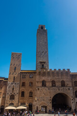 Obraz premium San Gimignano, Italy, 15 April 2022: Towers in the historic center