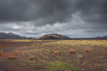 Wild volcanic landscape of Los Volcanes Natural Park in Lanzarote,  Canary Islands, Spain