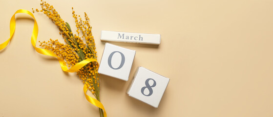 Calendar with date of International Women's Day and mimosa flowers on beige background